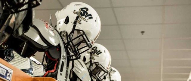 CSU Buccaneers' helmet and pads in their locker room.