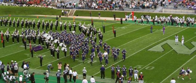 The Northwestern Wildcats enter the field.