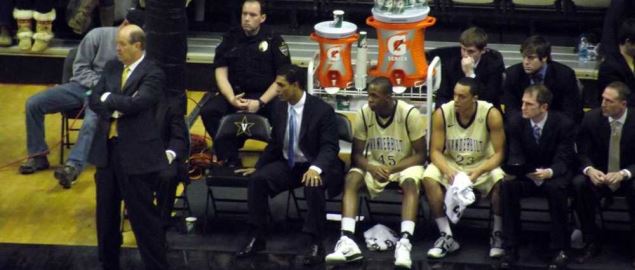 Kevin Stallings, with several assistants and players, during a Vanderbilt Commodores game.