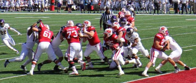 The Western Illinois Leathernecks rushing for yards against the Wisconsin Badgers.